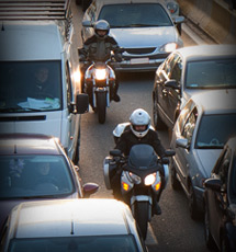 Motorcycles between two lanes of traffic on the highway