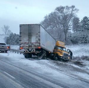 Truck jackknifed on winter highway