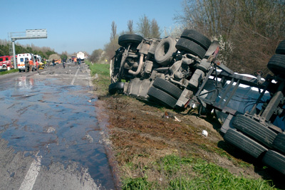 Truck rolled over on side of the road