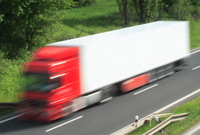 Red semi truck on road