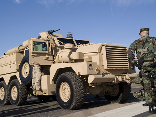 Military vehicle and soldier