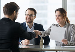 Interviewer shaking hands with prospective employee